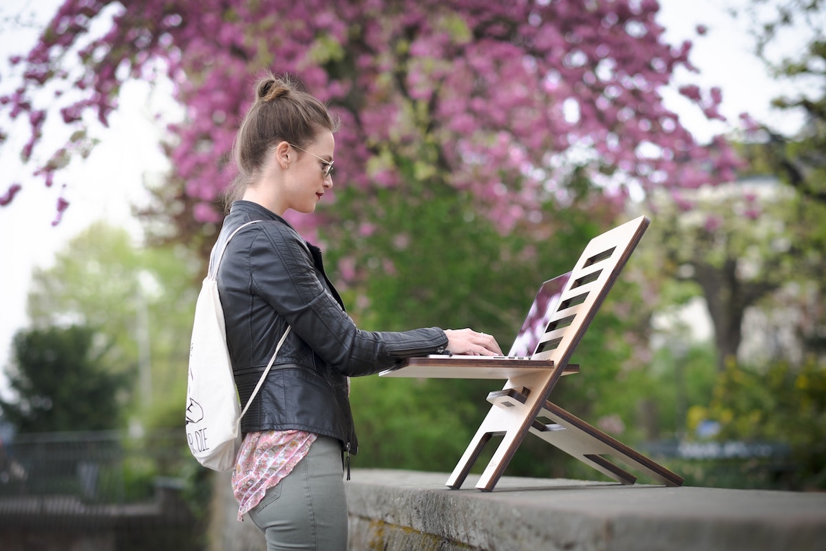 Mobile Workstation Female using cloud technology on a mobile workstation