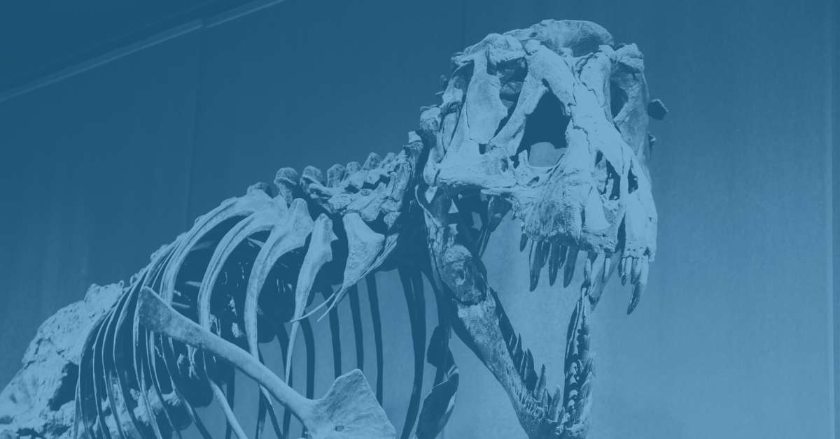 Dinosaur fossil embedded in layers of old spreadsheets and documents, representing legacy ERP data accumulated over decades.