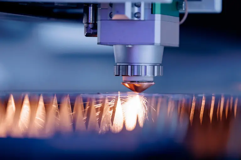 Precision laser cutting machine in a manufacturing facility, representing Epicor Kinetic for manufacturing ERP and production visibility.